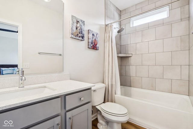 full bathroom featuring vanity, toilet, and shower / bath combo