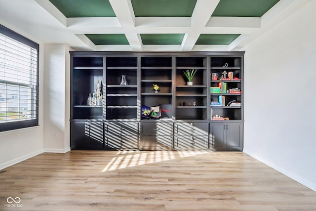 interior space featuring coffered ceiling, hardwood / wood-style flooring, and beamed ceiling