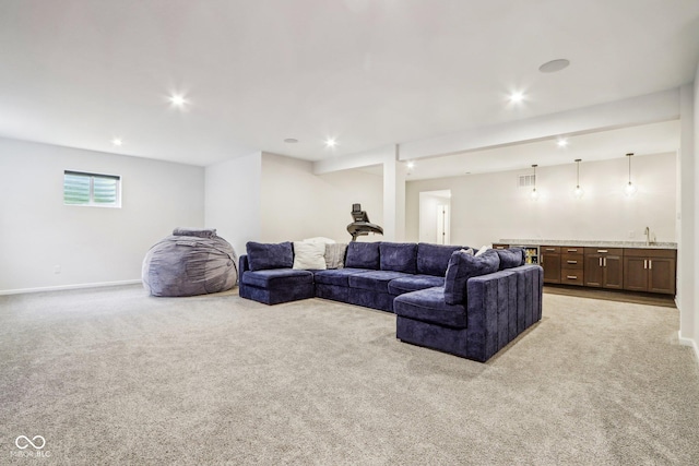 living room with indoor wet bar and light carpet