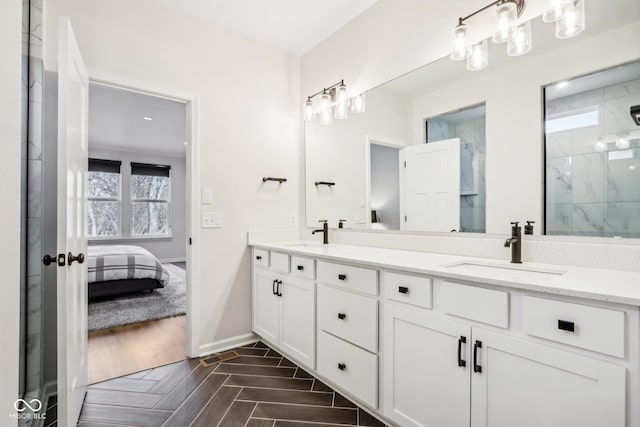 bathroom featuring vanity, parquet flooring, and walk in shower