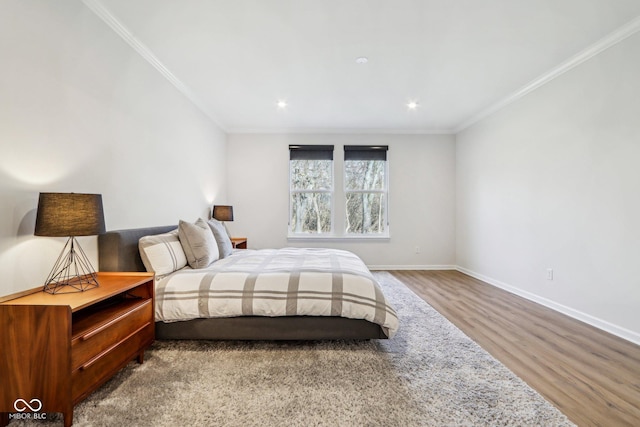 bedroom featuring hardwood / wood-style flooring and ornamental molding