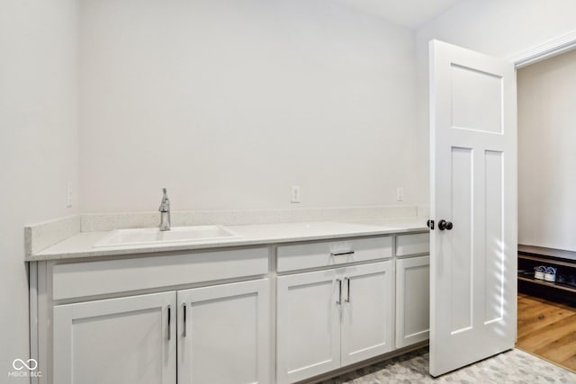 bathroom with vanity and wood-type flooring