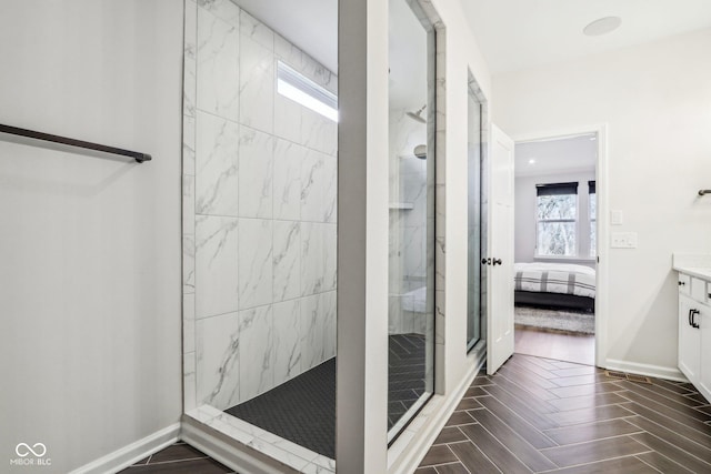 bathroom featuring vanity and a tile shower