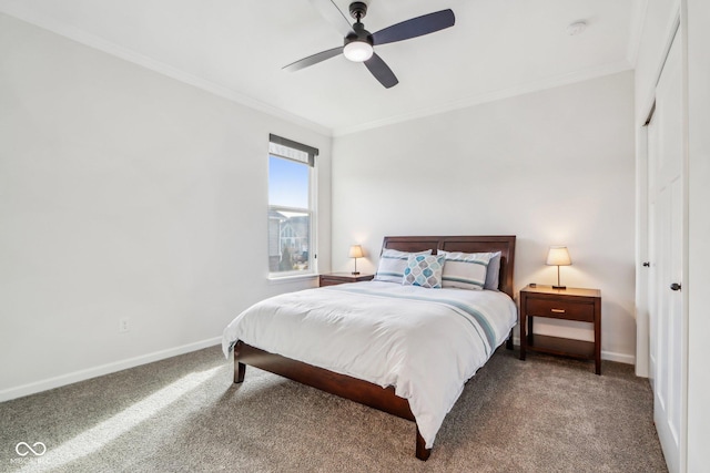 bedroom with ornamental molding, carpet flooring, ceiling fan, and a closet