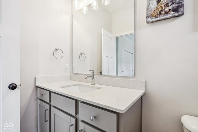 bathroom with vanity and toilet