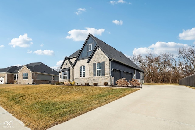 view of front of home featuring a garage and a front lawn