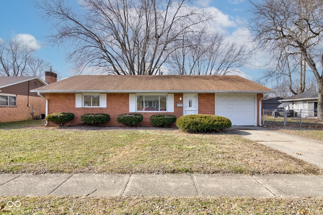 ranch-style home with driveway, a front yard, fence, and a chimney