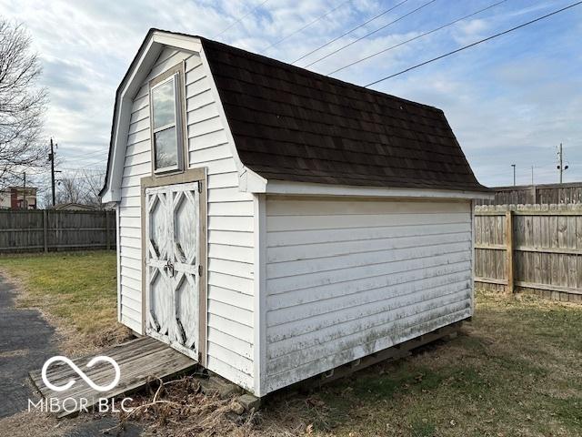 view of outdoor structure with a lawn