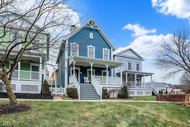 view of front facade featuring a front lawn and a porch