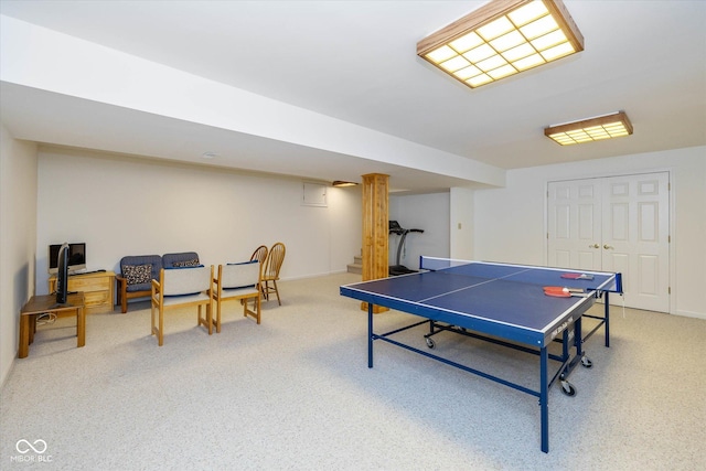 recreation room featuring light colored carpet