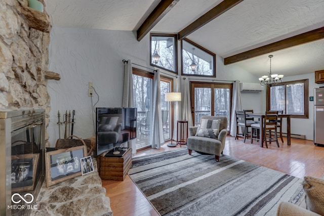 living room featuring a baseboard heating unit, vaulted ceiling with beams, a wall mounted air conditioner, a chandelier, and light wood-type flooring