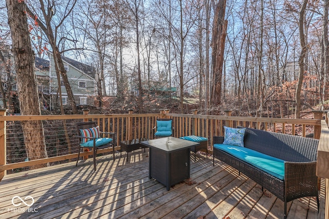 wooden terrace featuring an outdoor hangout area