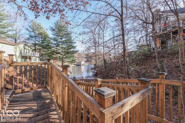 wooden terrace with a water view