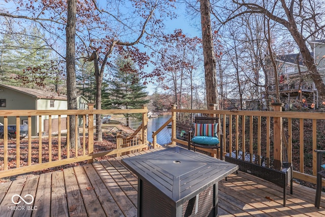 wooden terrace with a water view