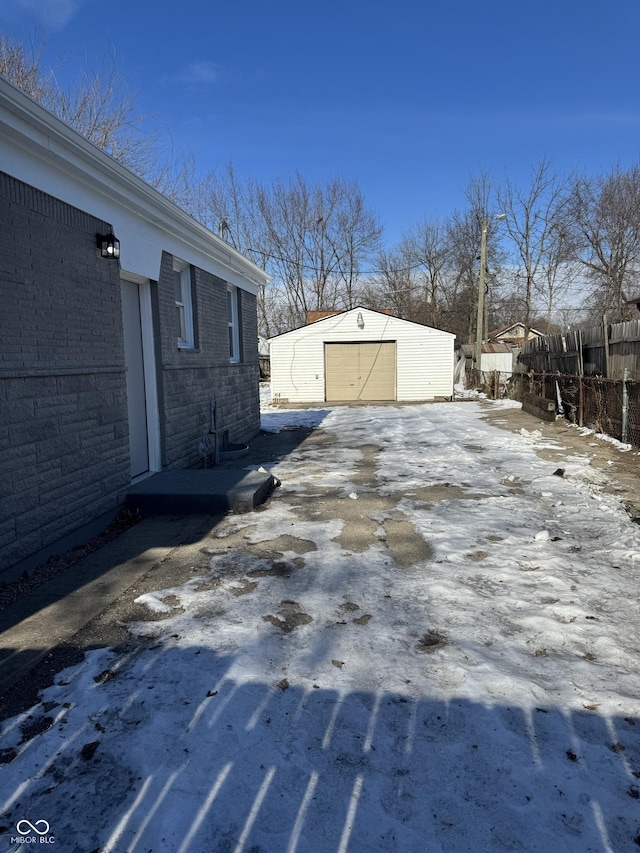 exterior space featuring a garage and an outdoor structure