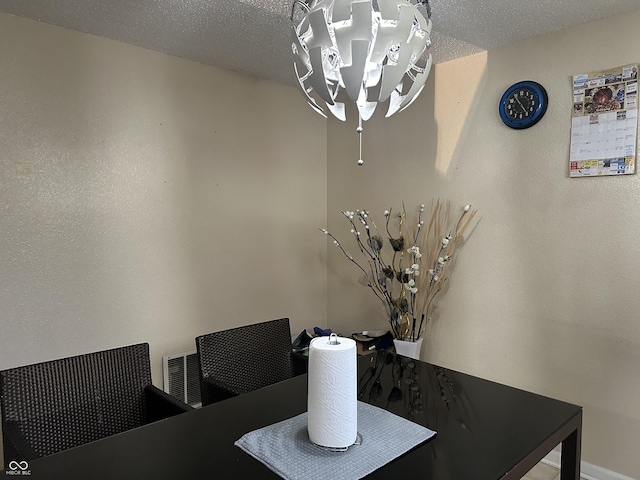 dining area with a textured ceiling