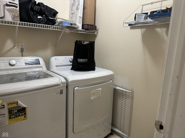 laundry room with washer and dryer