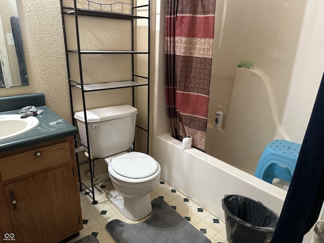 full bathroom with vanity, shower / bath combination with curtain, and toilet