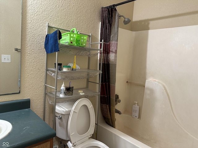 full bathroom featuring shower / bath combo, vanity, and toilet