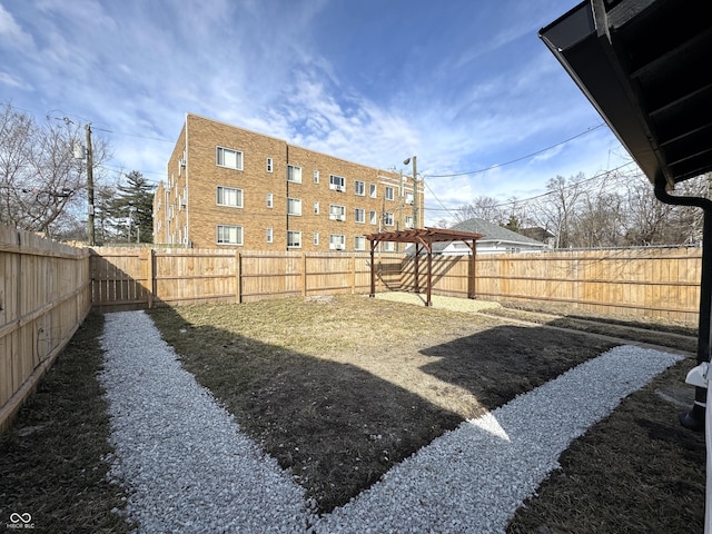 view of yard with a fenced backyard