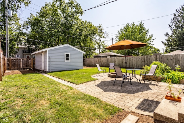 view of yard featuring a patio and a storage unit