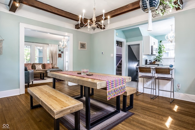 dining area with beam ceiling, plenty of natural light, dark wood-type flooring, and an inviting chandelier