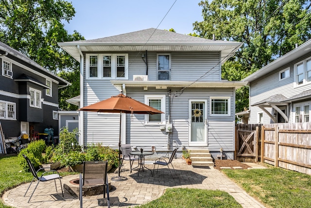 back of property with a patio