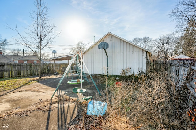 view of outbuilding featuring a playground