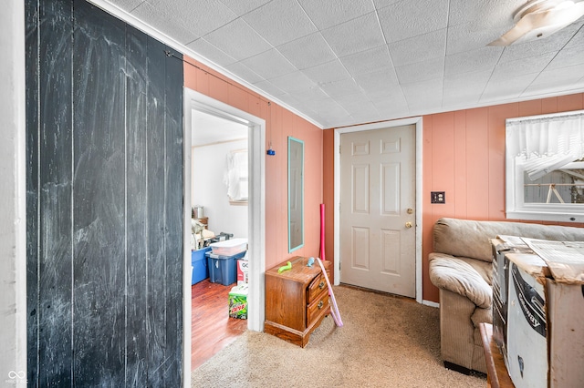 interior space featuring crown molding and light colored carpet