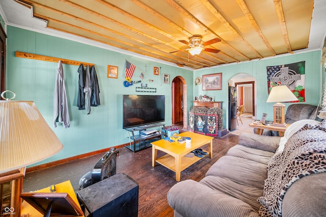 living room with dark wood-type flooring and ceiling fan