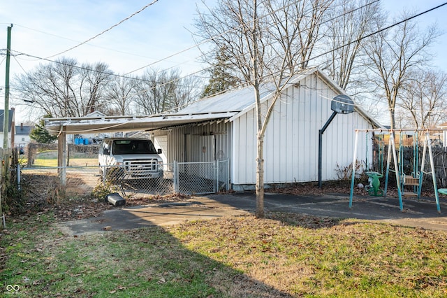 view of outbuilding with a carport