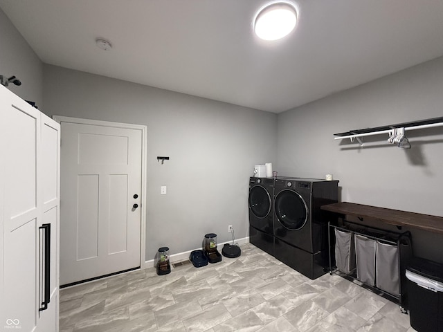 laundry room with separate washer and dryer