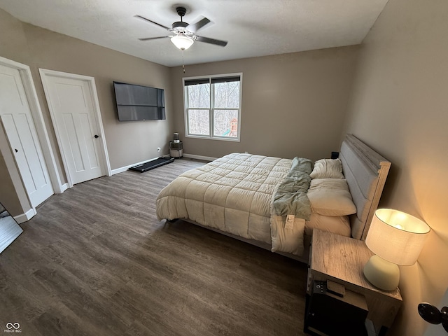 bedroom featuring dark hardwood / wood-style floors and ceiling fan