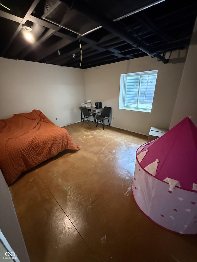 bedroom with concrete flooring