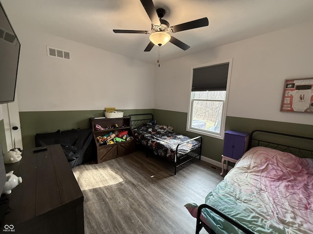 bedroom with wood-type flooring and ceiling fan