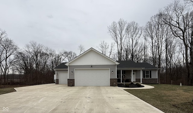 view of front of property with a garage and a front lawn