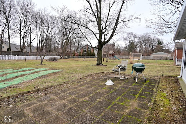 view of yard with a patio and a playground