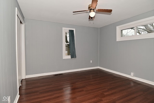 unfurnished bedroom with dark wood-type flooring and ceiling fan