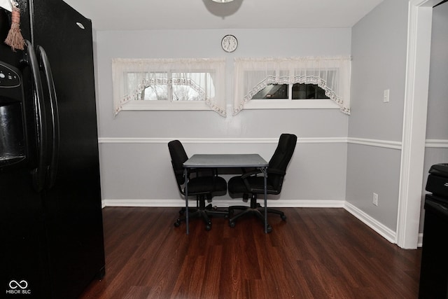 dining room featuring dark hardwood / wood-style flooring