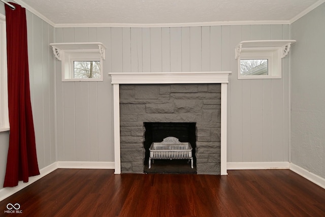 interior details with crown molding, hardwood / wood-style flooring, and a fireplace