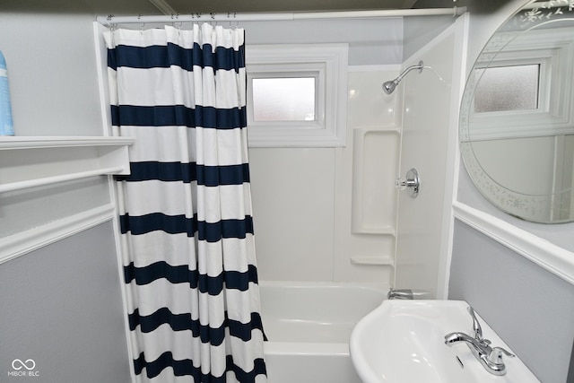 bathroom with sink and shower / tub combo