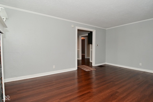 unfurnished room with ornamental molding, dark hardwood / wood-style floors, and a textured ceiling