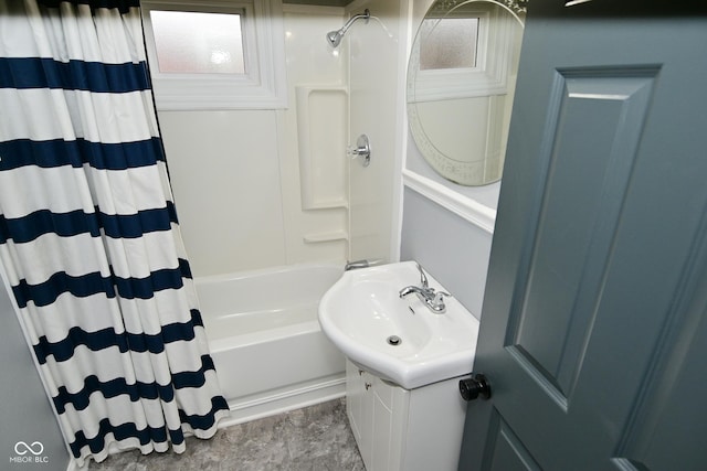 bathroom featuring vanity and shower / bath combo with shower curtain