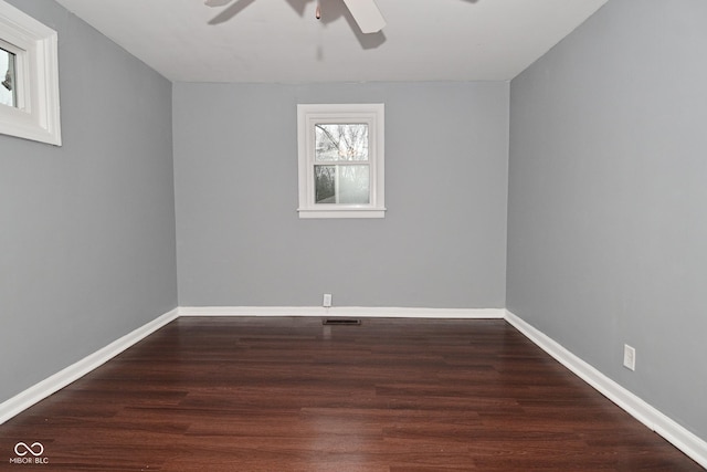 unfurnished room featuring dark hardwood / wood-style floors and ceiling fan