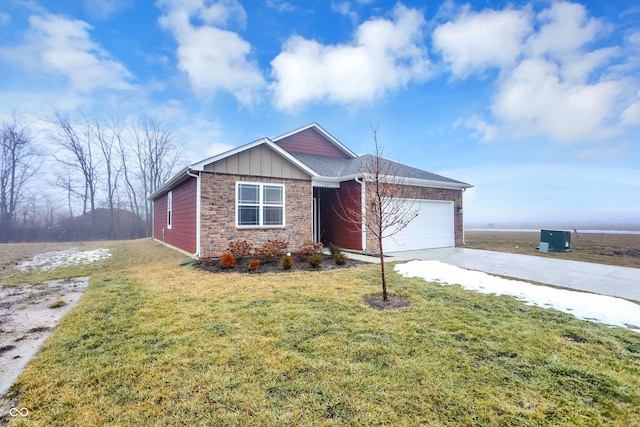 view of front of house with a garage and a front yard