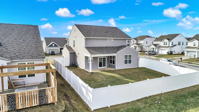 exterior space with central AC and a lawn