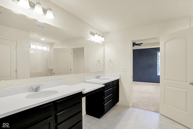 bathroom with walk in shower and vanity