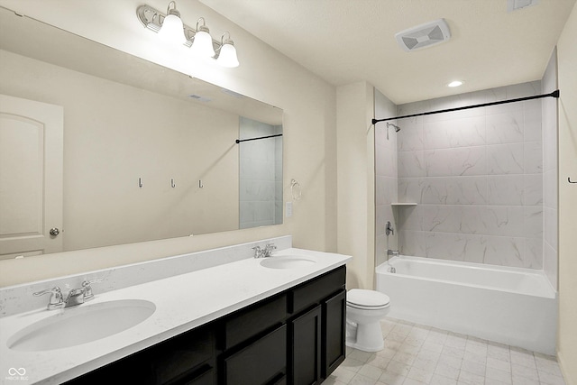 full bathroom featuring vanity, toilet, and tiled shower / bath