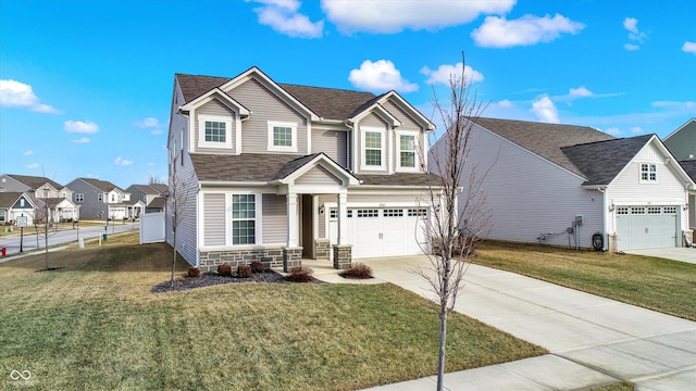 view of front of property with a garage and a front yard