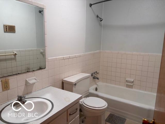 79 Circle Dr, Mooresville, IN 46158 - full bath featuring tile walls, vanity, and a wainscoted wall